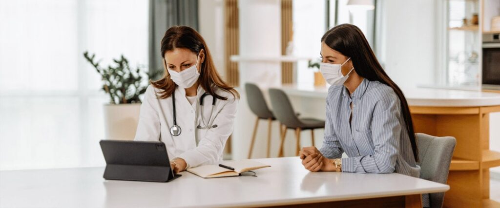 A man looking at a cost comparison between Medicare and private insurance