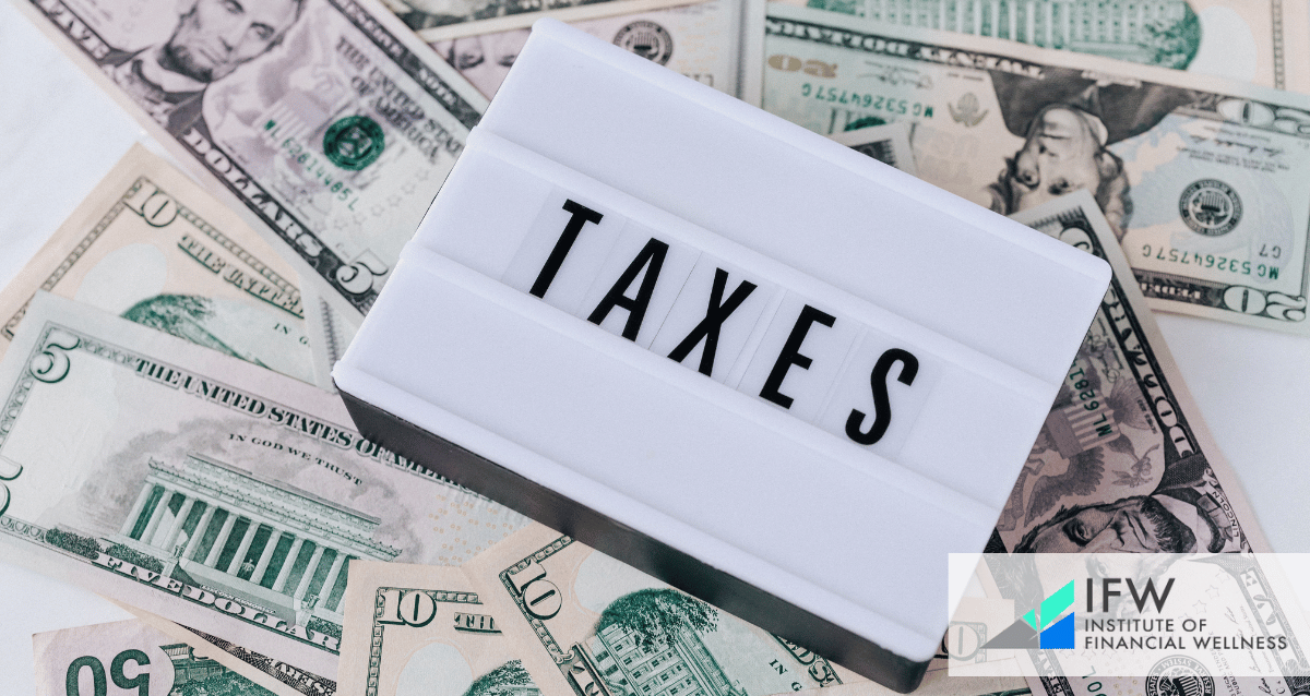 An image with dollar bills and the word taxes.